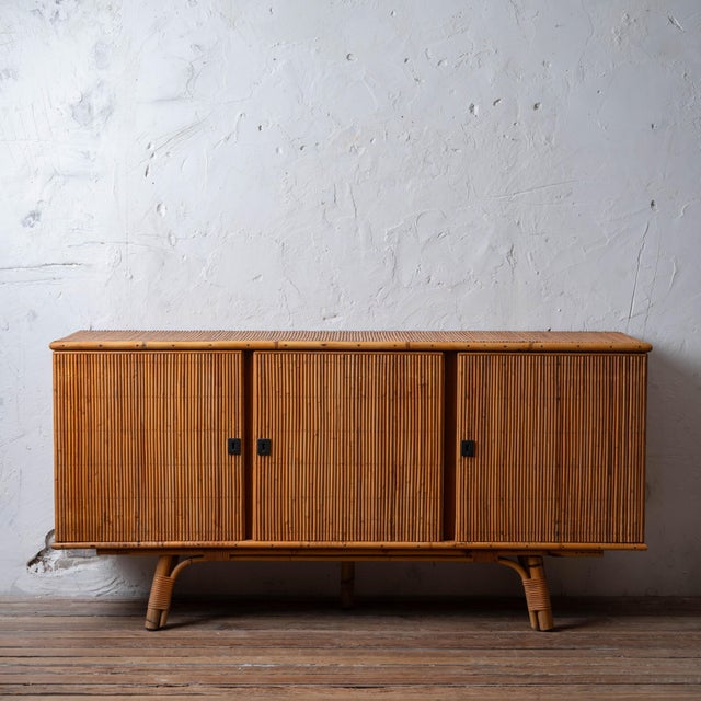 Adrien Audoux & Frida Minet bamboo sideboard, France, c.1960s. Three-door cabinet in bamboo with black hardware and raised...