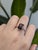 A harmony of contrast and craftsmanship, this bi-color tourmaline ring is centered on a 3.2-carat emerald-cut gem, held...