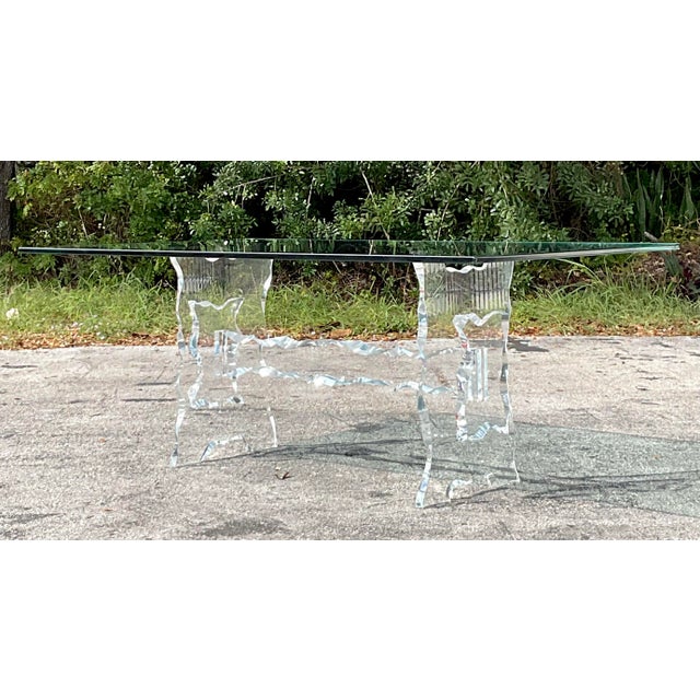 Make a bold statement with this vintage boho sculpted Lucite dining table. Featuring a beautifully crafted Lucite base...
