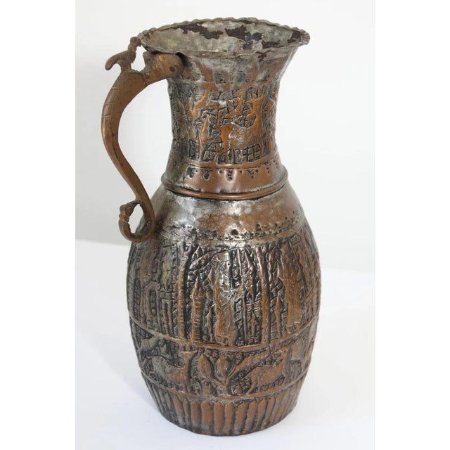 19th century Middle Eastern Arabian tinned copper coffee pot.A bird on top of the handle.Hand-hammered and chased copper...