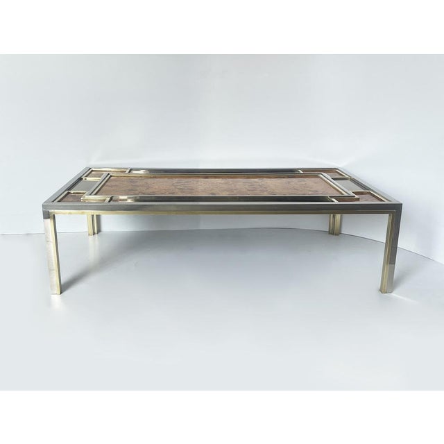 Elegant 1970s vintage coffee table, finely crafted from chromed steel, brass, rectangular mirrors on the top, and...