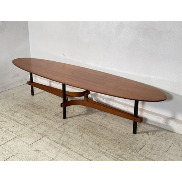 The oval shape is no accident: Ulrich loved curved lines because they gave spaces a fluidity that rectangular tables...