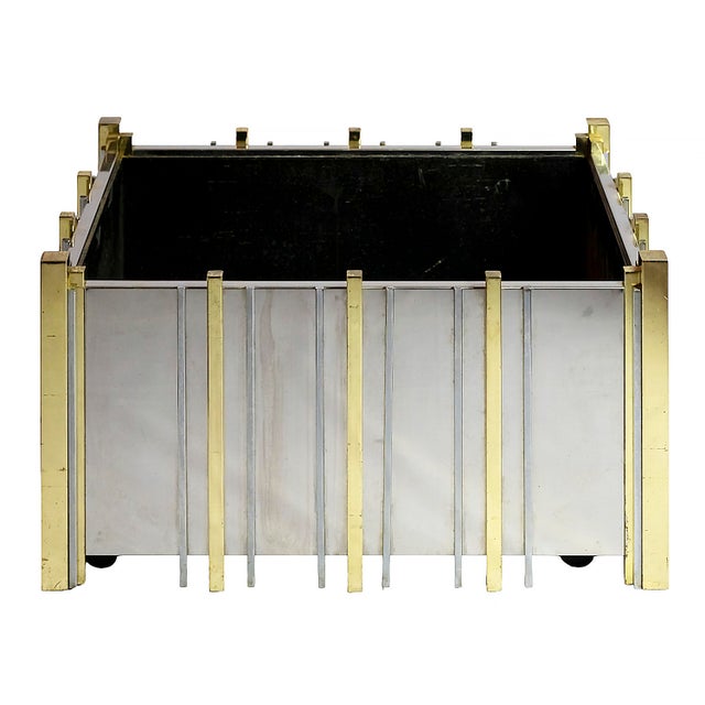 Large vintage Italian planter in chrome and brass from the 1970s. Solid and heavy planter is on wheels that works...