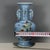 Chinese Light Blue Glazed Porcelain Vase With Famille Rose Antiques Motif For Sale - Image 4 of 9