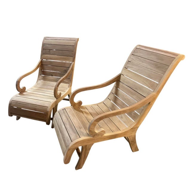 Elevate your outdoor oasis or sunroom with this striking pair of vintage teak steamer lounge chairs. Masterfully crafted...