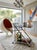 A rolling serving cart with an architectural "Z" design, typical of the 2000s and inspired by the Space Age aesthetic....