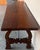 Dining table made of walnut with carved lyre legs and heavy top. The lyre legs are very thick. Beautiful iron stretcher,...