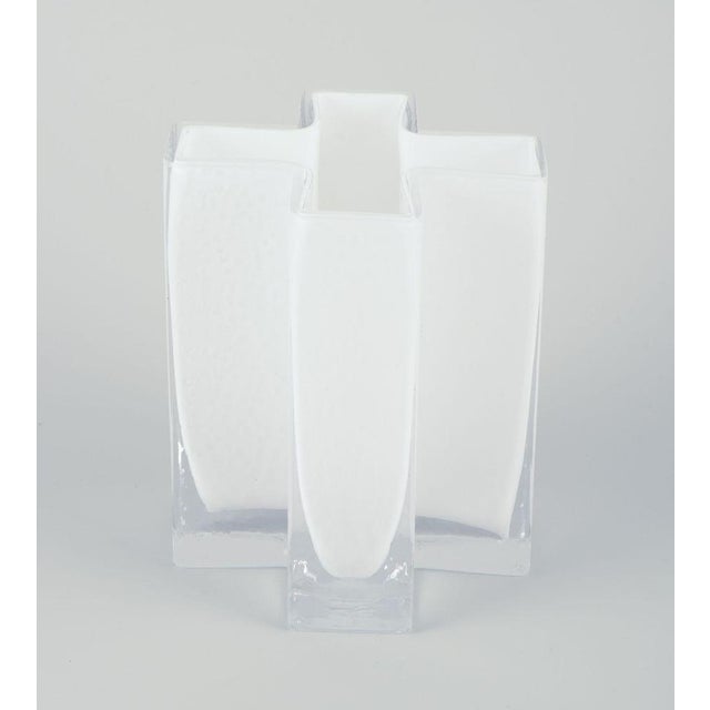 Bodil Kjær for Gullaskruf, Sweden. ‘Kryds’ (cross) vase in white and clear art glass. Dating: 1960s. In excellent...