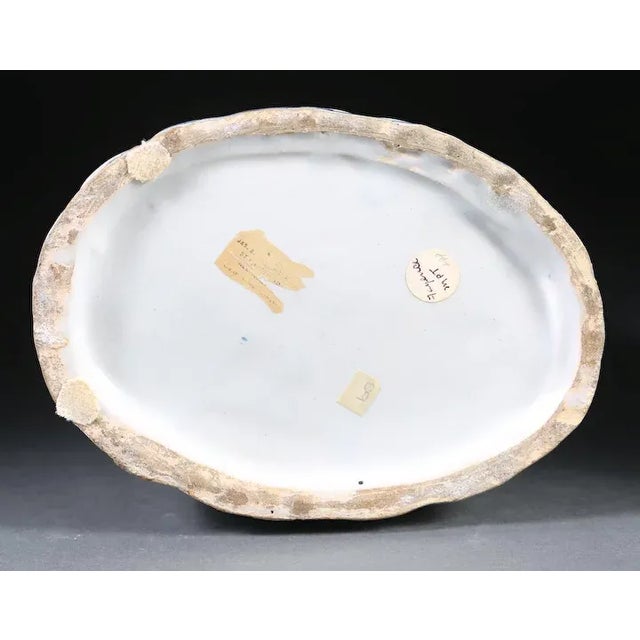 Antique 19th c. Continental tin glaze faience figural decanter in the form of a woman with flowers. Large size - measures...