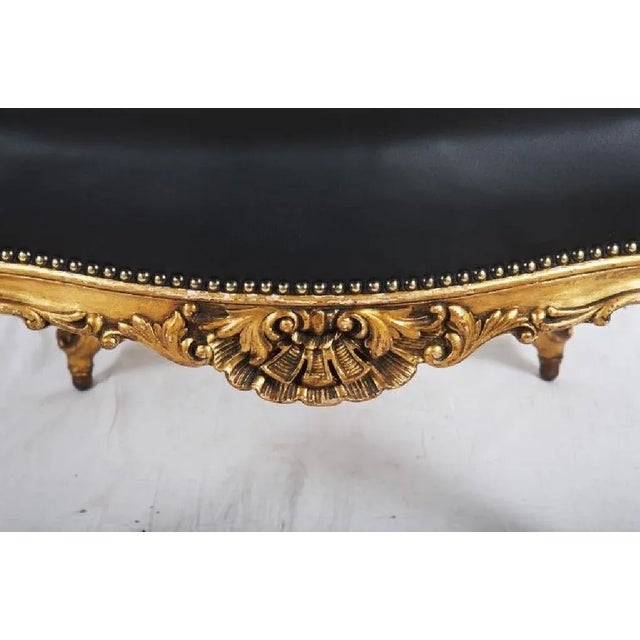 - Rococo style black leather upholstered open armchair on cabriole legs with balls on the ends, gold plated - Made in...