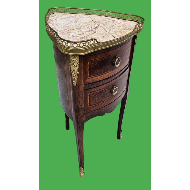 This French Louis XV Style Marble Top Bronze Mounted Tripod Side Table is a stunning period piece from the Rococo era....