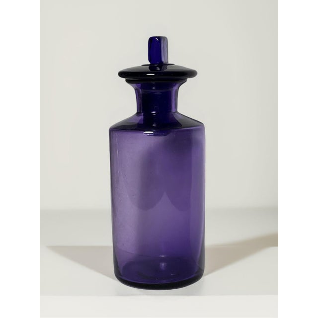 Antique 19th century English handblown amethyst purple pharmacist apothecary jar with original stopper, circa 1880-1900....