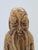 A unique, expressively crafted figurine depicting a bearded sage, rendered in the Art Deco / Modernist style of the first...