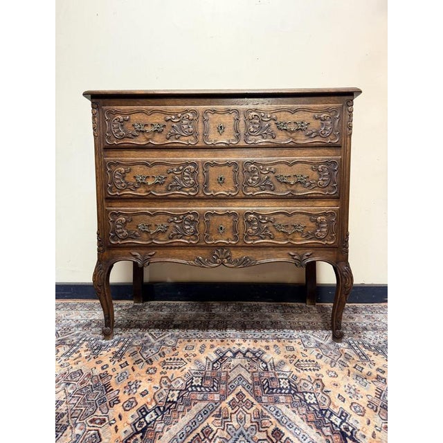 Beautiful antique chest of drawers in solid French oak, full of character and classic provincial style. The piece features...