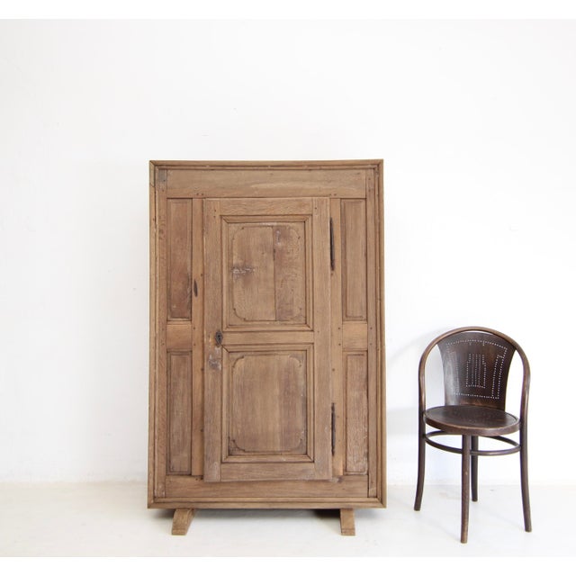 A small provincial cupboard from the early 19th century. Crafted from solid oak. Originally, this piece of furniture was a...