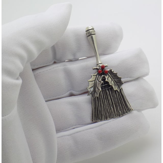 This horizontal scale Italian miniature represents a traditional cultural object known as a "scopetta spazzaguai," a...