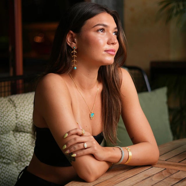 Celebrate the magic of ocean life with the Starfish Ocean Spirit Animal Turquoise & Gold Pendant Chain Necklace. This...