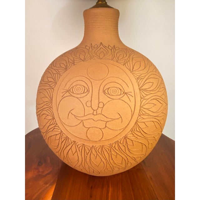 A lovely happy inscribed raw clay Sun lamp by the Oregon Ceramicists Larry & Terry Brown. It's signed Brown nest to the...