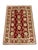 This Persian-style wool accent rug features an allover floral pattern in warm beige against a rich red field. A...