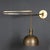 Eccentric pair of articulated wall lights made in Italy circa 1960's. These lights were designed by Franco Albini and...