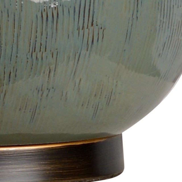 Reminiscent of a fig due to its shape and texture, fig lamp features a sleek moss green glazed ceramic. This 25" table...