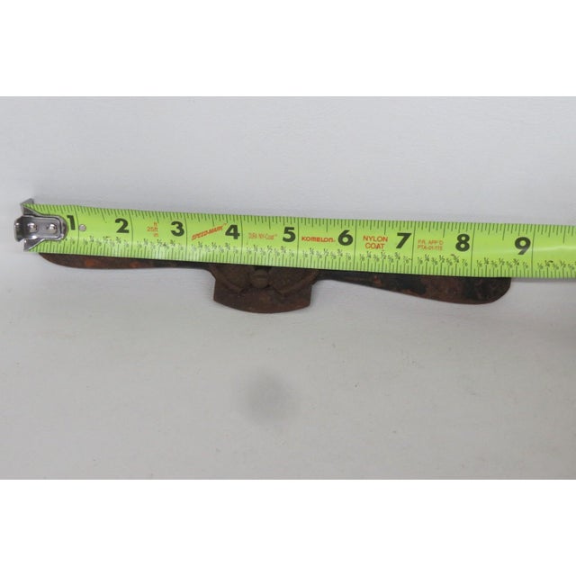 This gorgeous Antique Spokeshave is made out of cast iron. This charming piece of history is a woodworking hand tool...
