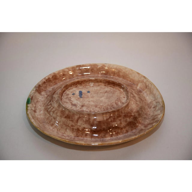 Oval Majolica low bowl with rolled collar. 20th Century. Unsigned.