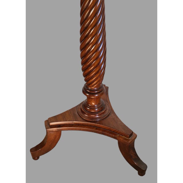 This antique octagonal side table is a true gem for any Victorian-style décor. The barley-twist tripod base adds a touch...