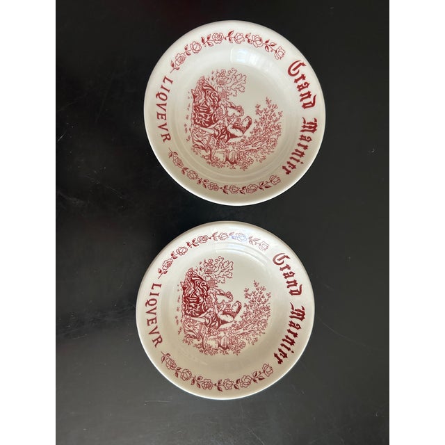 8 small bowls from the Gien pottery factory, Grand Marnier liqueur. Height: 2.5 cm. Diameter: 12 cm. This piece has an...