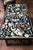 A gorgeous black marble coffee/center table with hand-inlaid semi-precious stones in the Pietra Dura style. Beautiful...