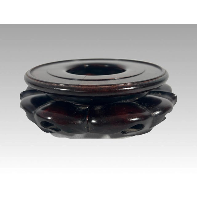 Elegant vintage Chinese solid rosewood hand carved tiered stand made in Hong Kong. This satin smooth piece rests on five...