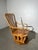 Charming vintage American rocking chair made in solid wood with a warm honey finish. This model combines a classic rocking...