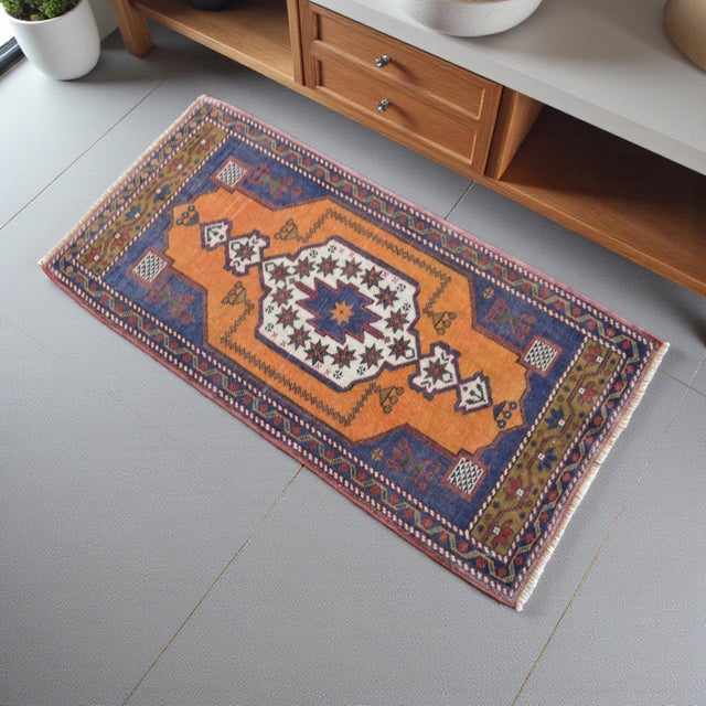 An authentic 1970s hand-knotted small rug from Nigde – Tashpinar, Central Anatolia. This charming piece features a vibrant...