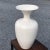 A fantastic artisan made sculptural ceramic vase fired in a white glaze finish by the California pottery company Jaru.