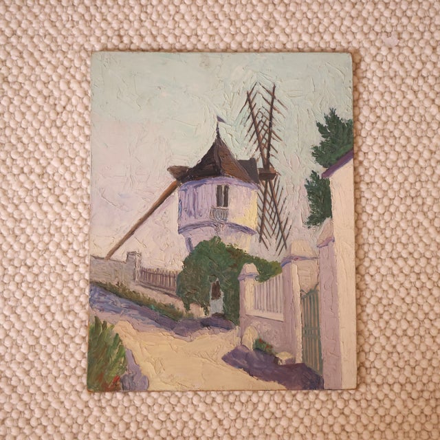 20th Century French Windmill Painting capturing a charming village scene with a softly rendered windmill rising above...