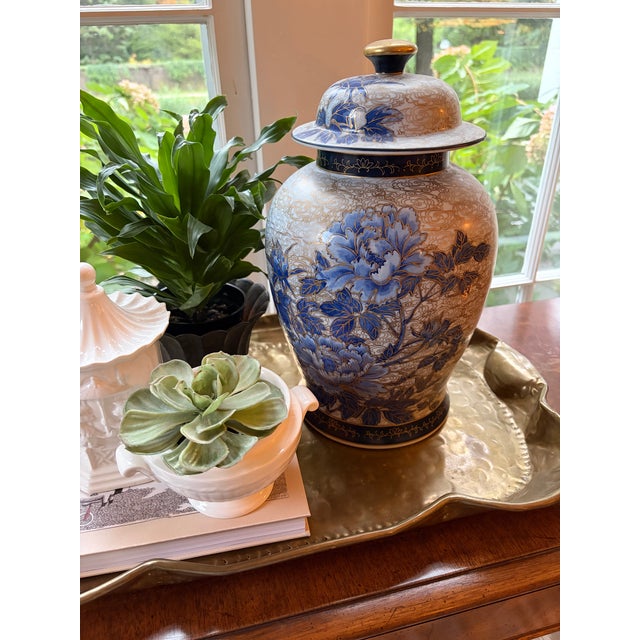 This large chinoiserie ginger jar is intricately detailed from every angle with cloud-like gold swirls and gold-traced...