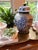 This large chinoiserie ginger jar is intricately detailed from every angle with cloud-like gold swirls and gold-traced...
