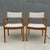 A pair of Scandinavian mid century modern solid teak captain’s chairs / armchairs with tweed upholstery, designed by...