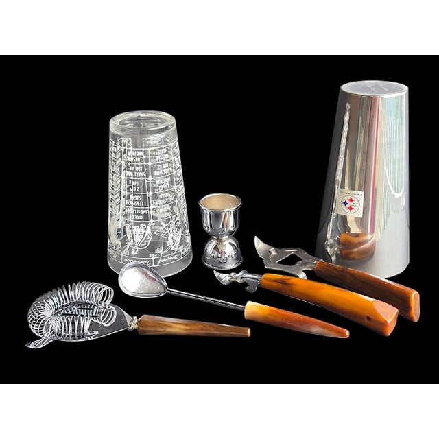Offered is a fabulous set of vintage mid 20th century cocktail and bar tools. It includes a stainless steel shaker, a...