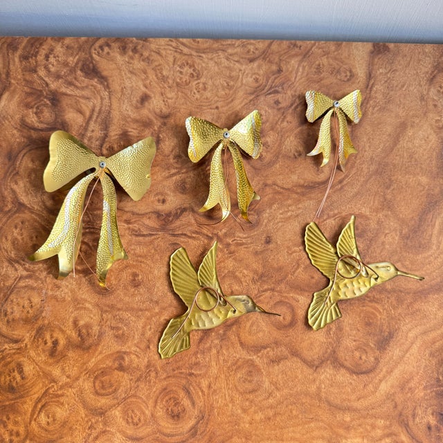 Five pieces of brass wall decorative items. Not made of solid brass but a brass and copper plating or something along...
