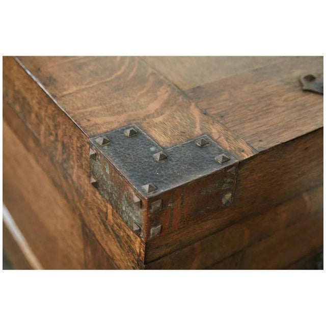 This trunk from the early 20th century is a great example of the arts and crafts movement with ironwork and simple lines.