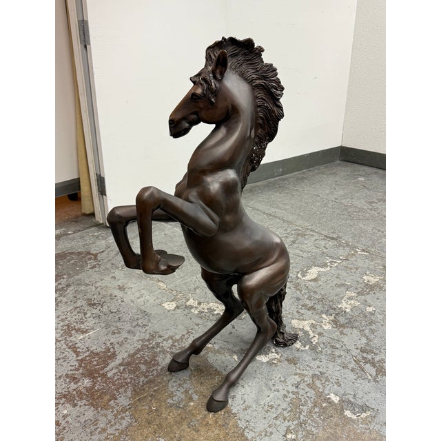 Design Plus Gallery presents a Rearing Horse Bronze Sculpture. This equestrian sculpture depicts a spirited horse rising...