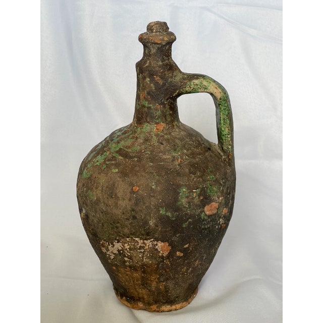 Mid to early 20th-Century pottery storage jar from the Mediterranean area of Europe, probably used for olive oil. It has 1...