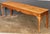 A fine English grand hall bench or country house window seat of patinated oak, featuring a rectangular top over a...
