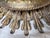 Striking gilt iron ceiling mount light fixture in the form of a radiant sunburst, designed by Miamar Home. This sculptural...