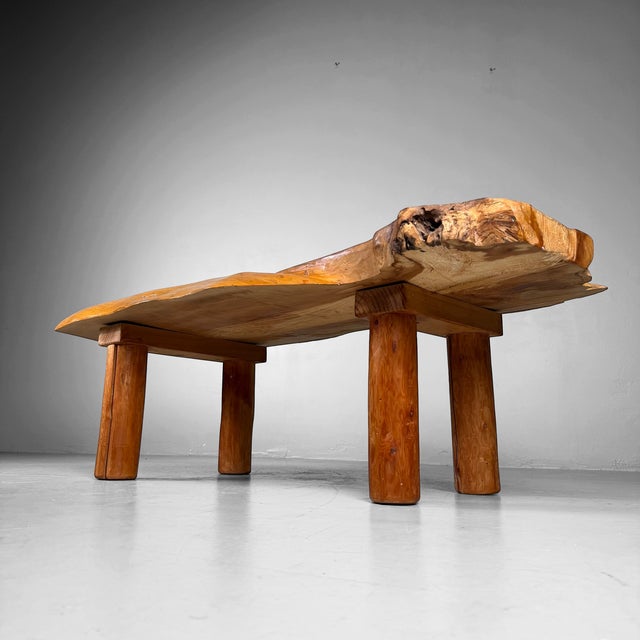 A distinctive japanese side table from the 1960s, crafted from a solid slab of wood (zelkova) with a pronounced organic...