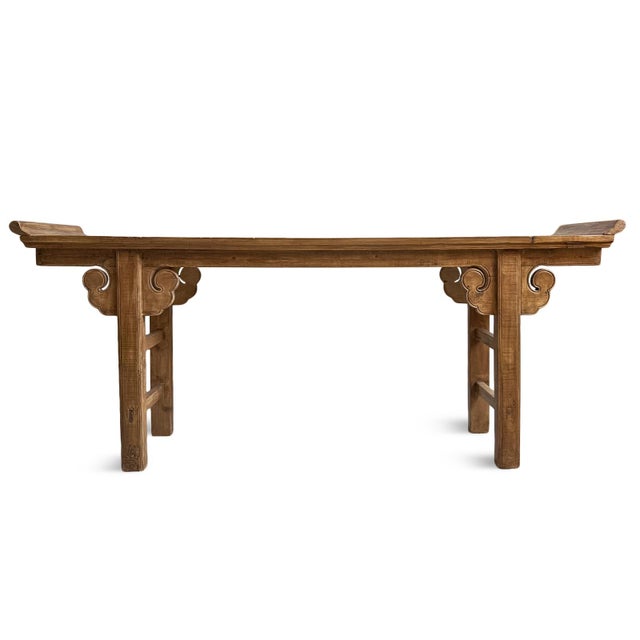 Vintage elm Chinese altar console table with long, narrow silhouette, gracefully upturned ends, and hand-carved cloud...