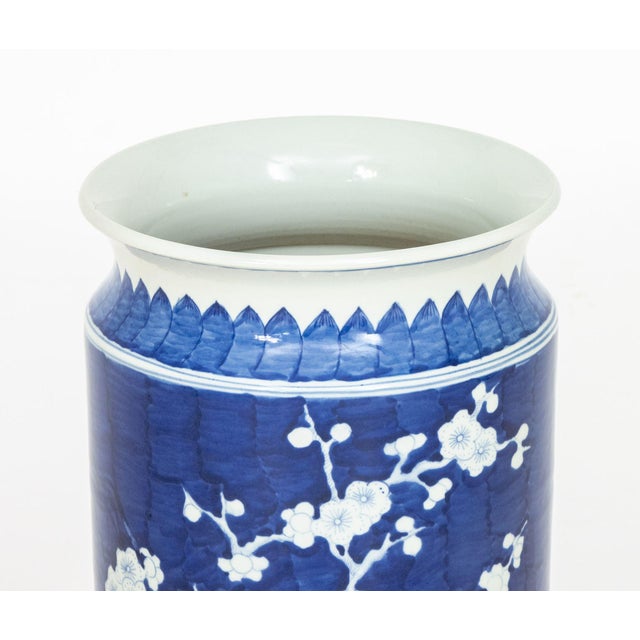 Chinese Blue and White Porcelain Umbrella Stand, hand-painted with prunus flower motif. 23" H x 11.25" Diameter....