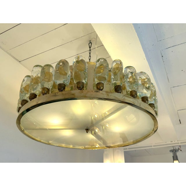 Chandelier ceiling pendant light lightning lamp flush mount in brass and massive Murano glass flame with gold leaf....