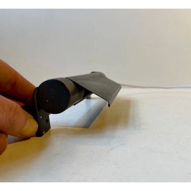 A rare tubular wall sconce in 'brown-treated' brass. Number 10866 'rørlampet' (tube light) in the louis poulsen catalogue...